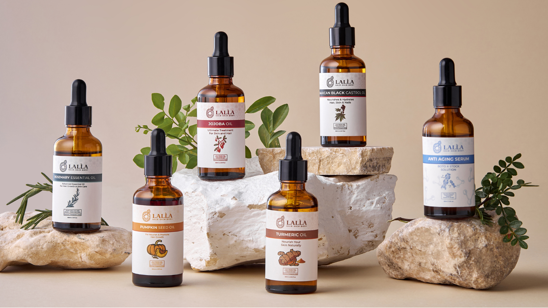 Collection of Laila skincare products on a neutral background with rocks and plants.
